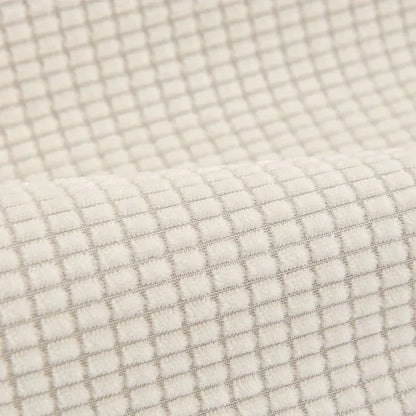 Gros plan du velours beige à petits carreaux en relief de la housse de canapé antidérapante