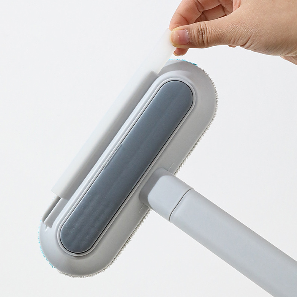 Dos de la tête de la brosse anti-poils Le Sceptre de Velours, avec sa raclette souple tirée de son logement