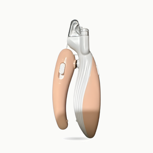 Coupe-griffes pour chat rose et blanc à lampe LED, vue de trois quarts sur fond crème