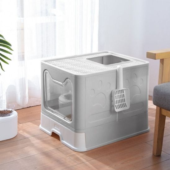 Maison de toilette pliable coloris gris vue de trois quarts arrière, pelle à litière accrochée sur le côté